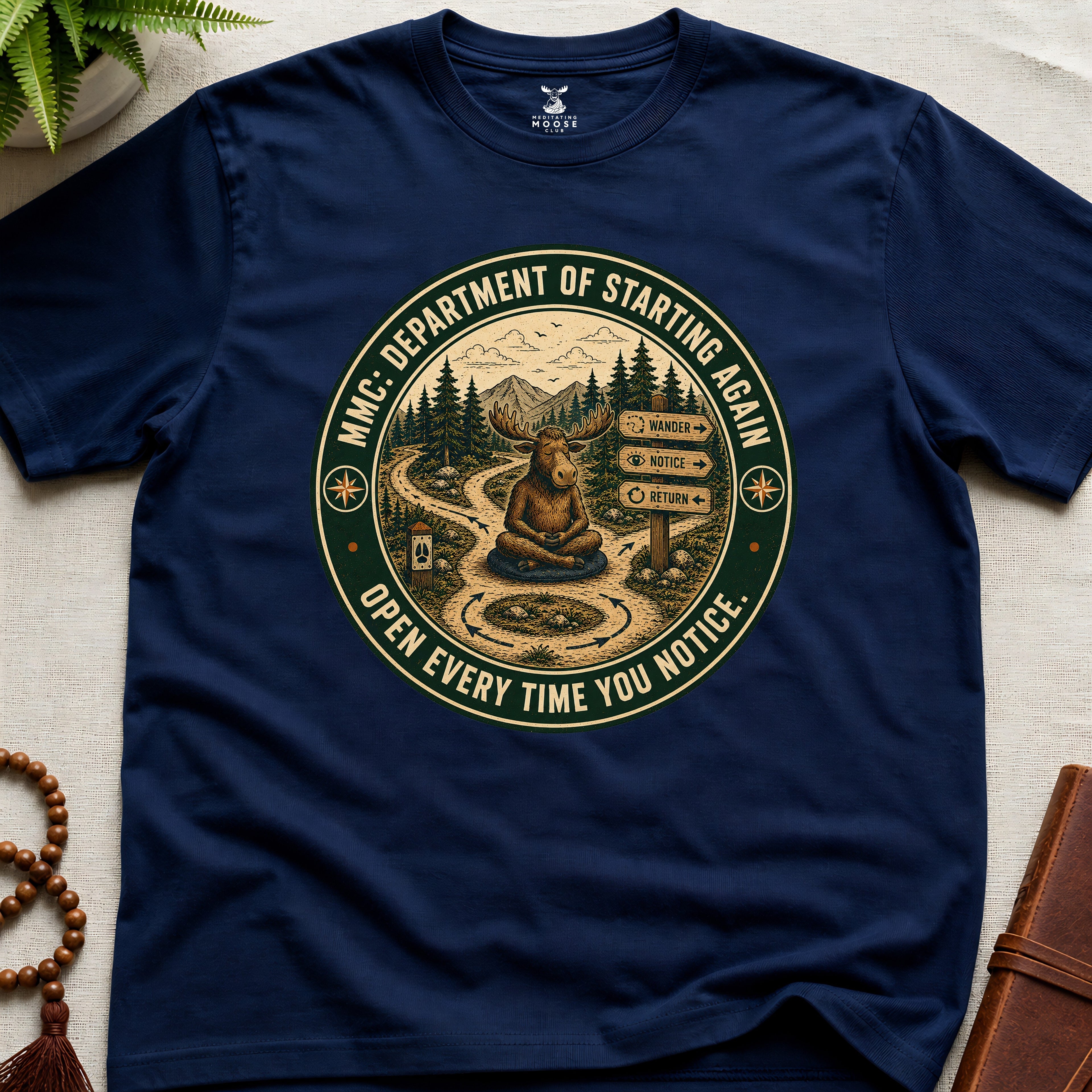 Navy funny mindfulness t-shirt mockup featuring Meditating Moose Club Department of Starting Again moose graphic