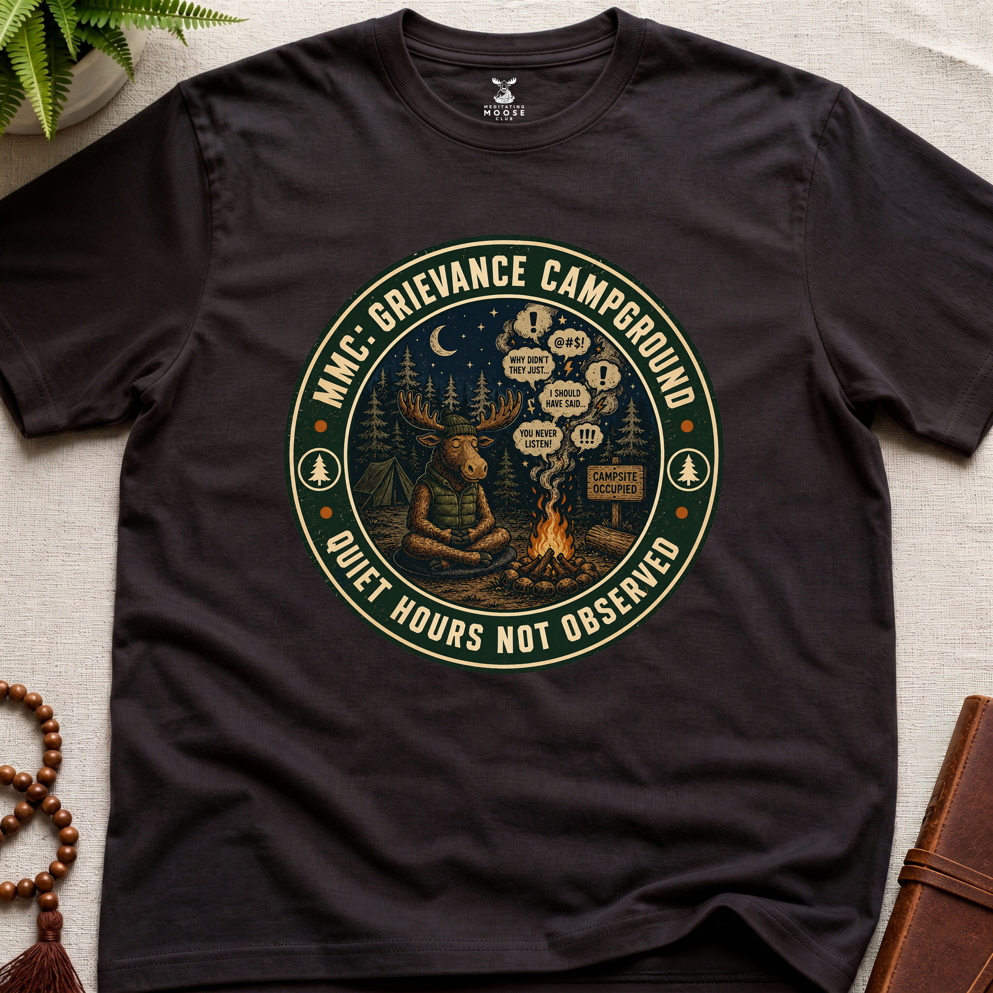 Dark brown funny mindfulness t-shirt mockup featuring Meditating Moose Club Grievance Campground overthinking graphic