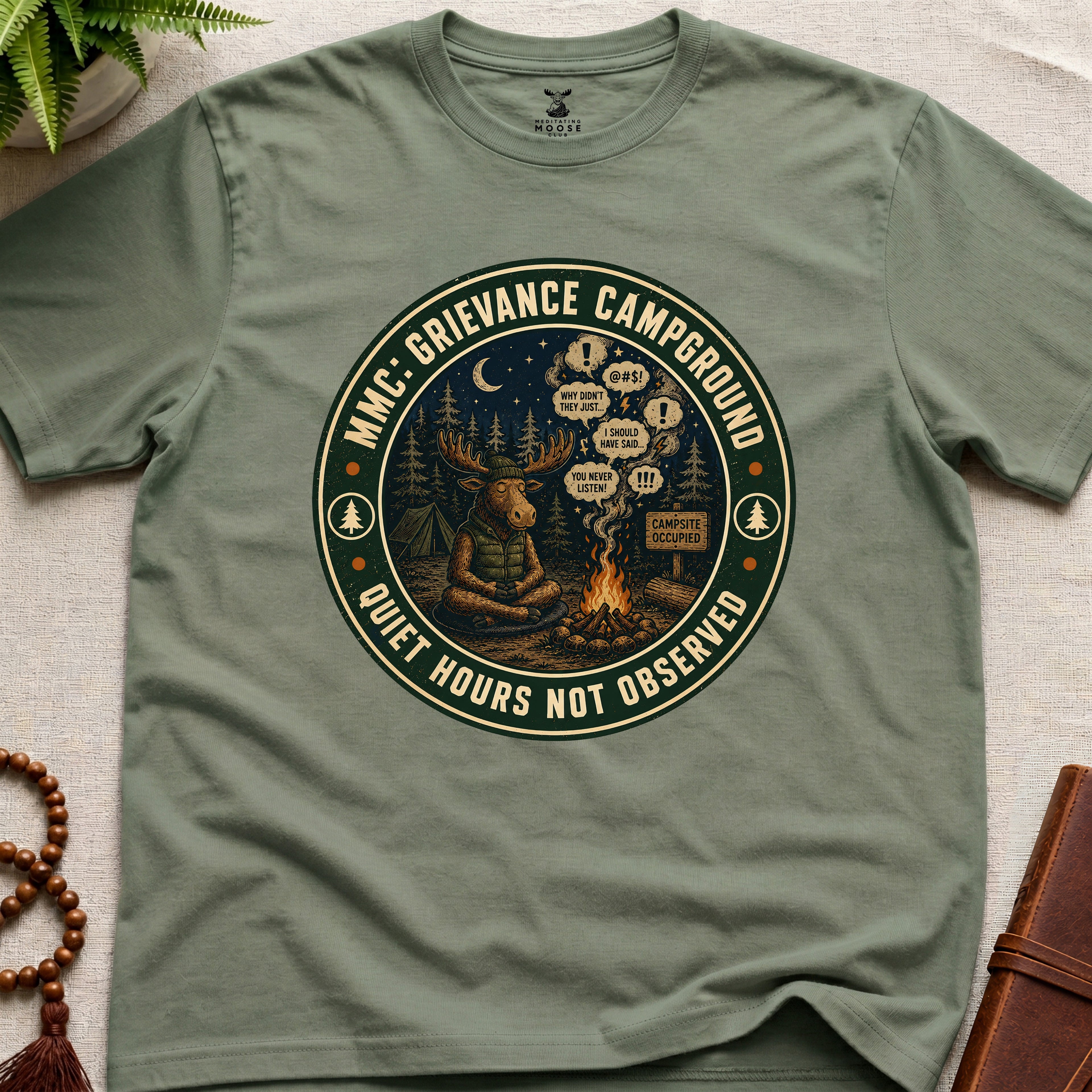 Green funny mindfulness t-shirt mockup featuring Meditating Moose Club Grievance Campground overthinking graphic