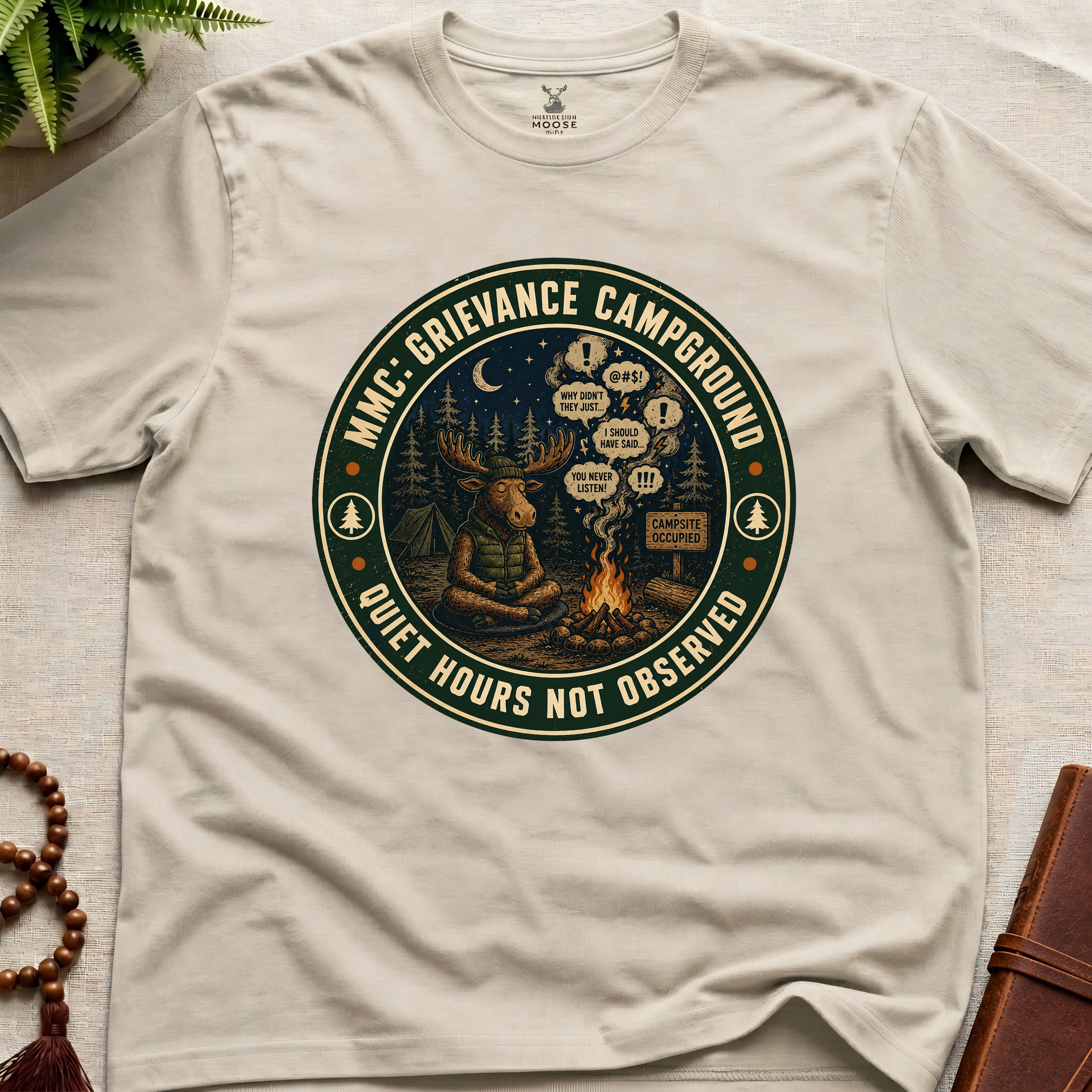 Beige funny mindfulness t-shirt mockup featuring Meditating Moose Club Grievance Campground overthinking graphic