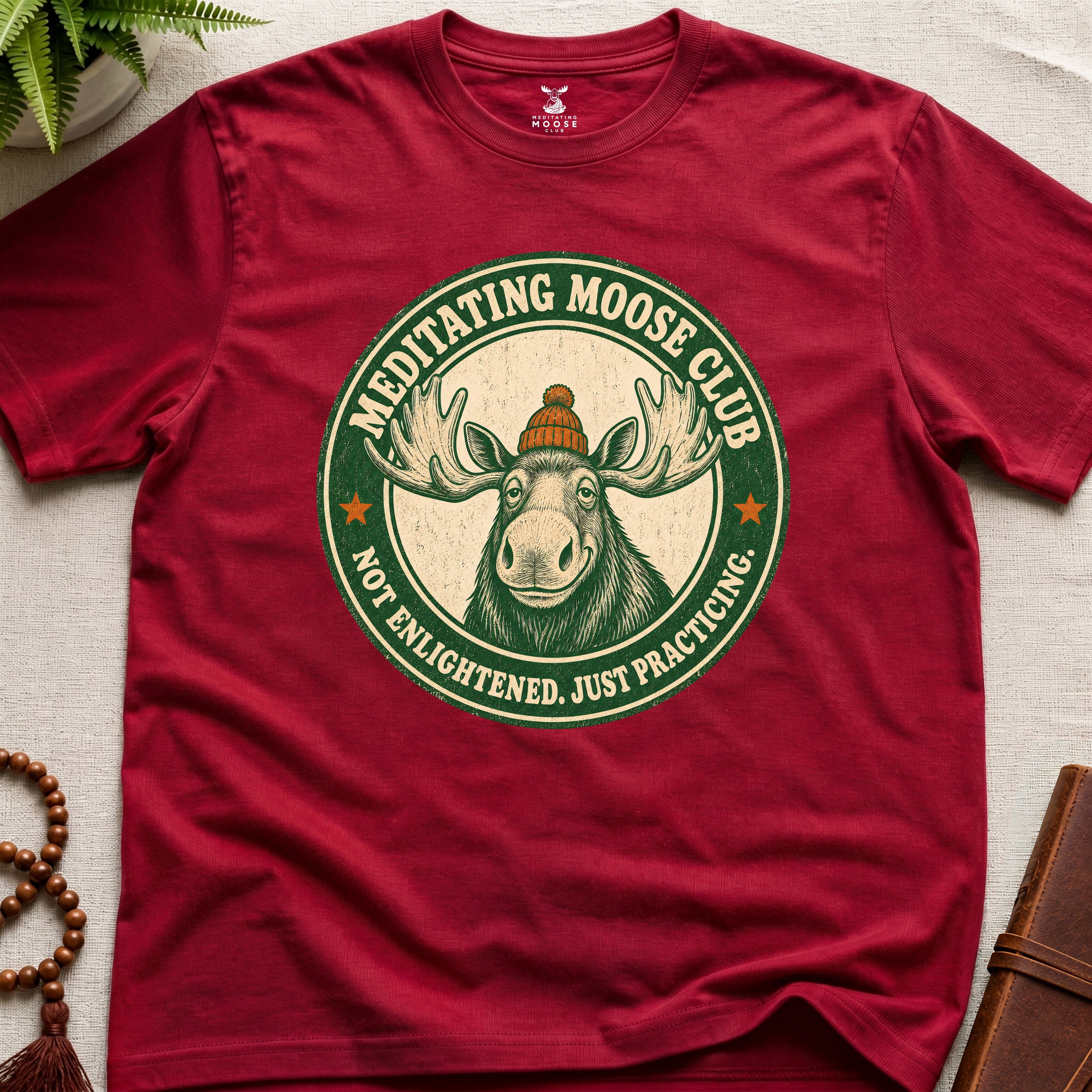 Red mindfulness t-shirt mockup featuring Meditating Moose Club signature moose logo graphic