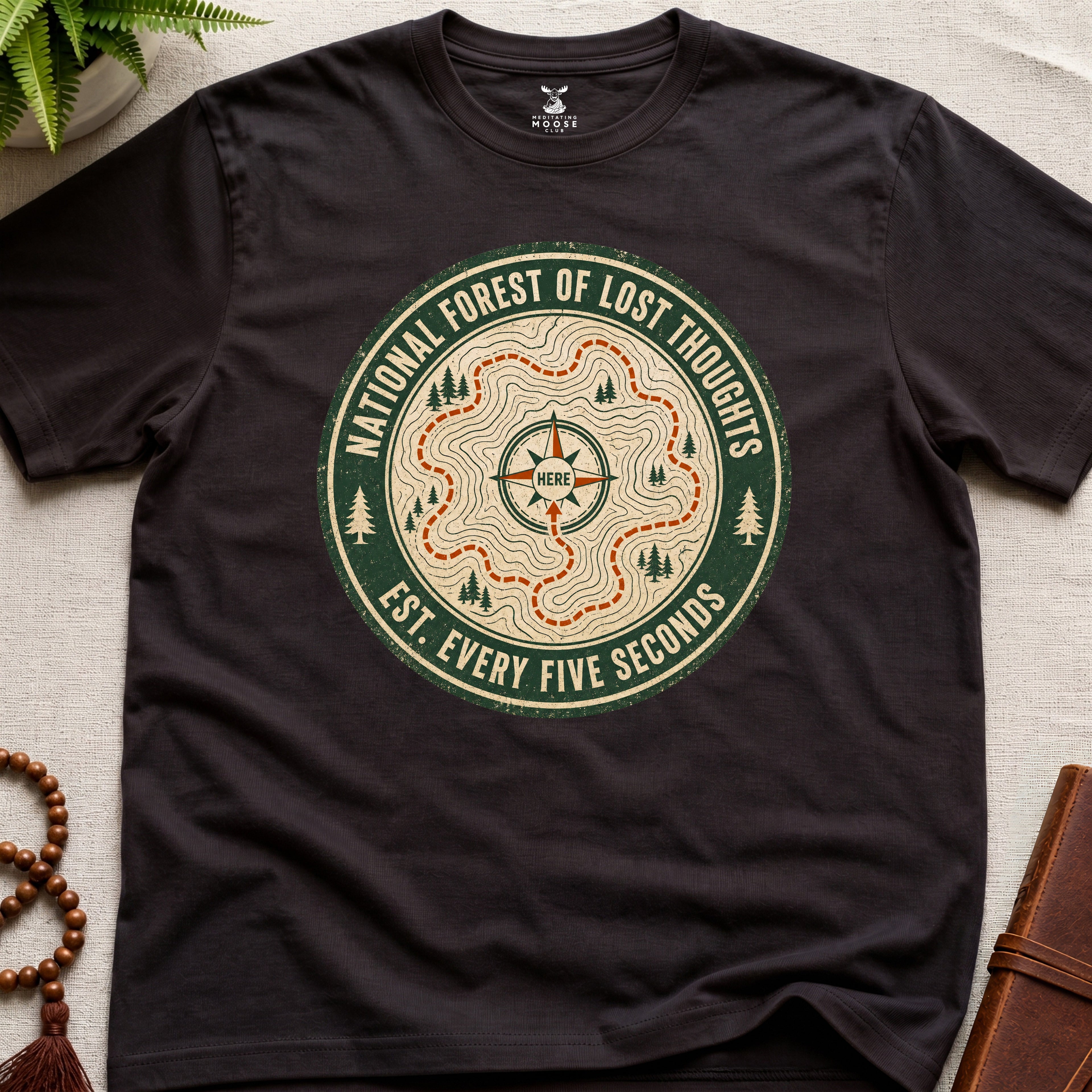Dark Brown mindfulness t-shirt mockup featuring National Forest of Lost Thoughts vintage trail map meditation graphic