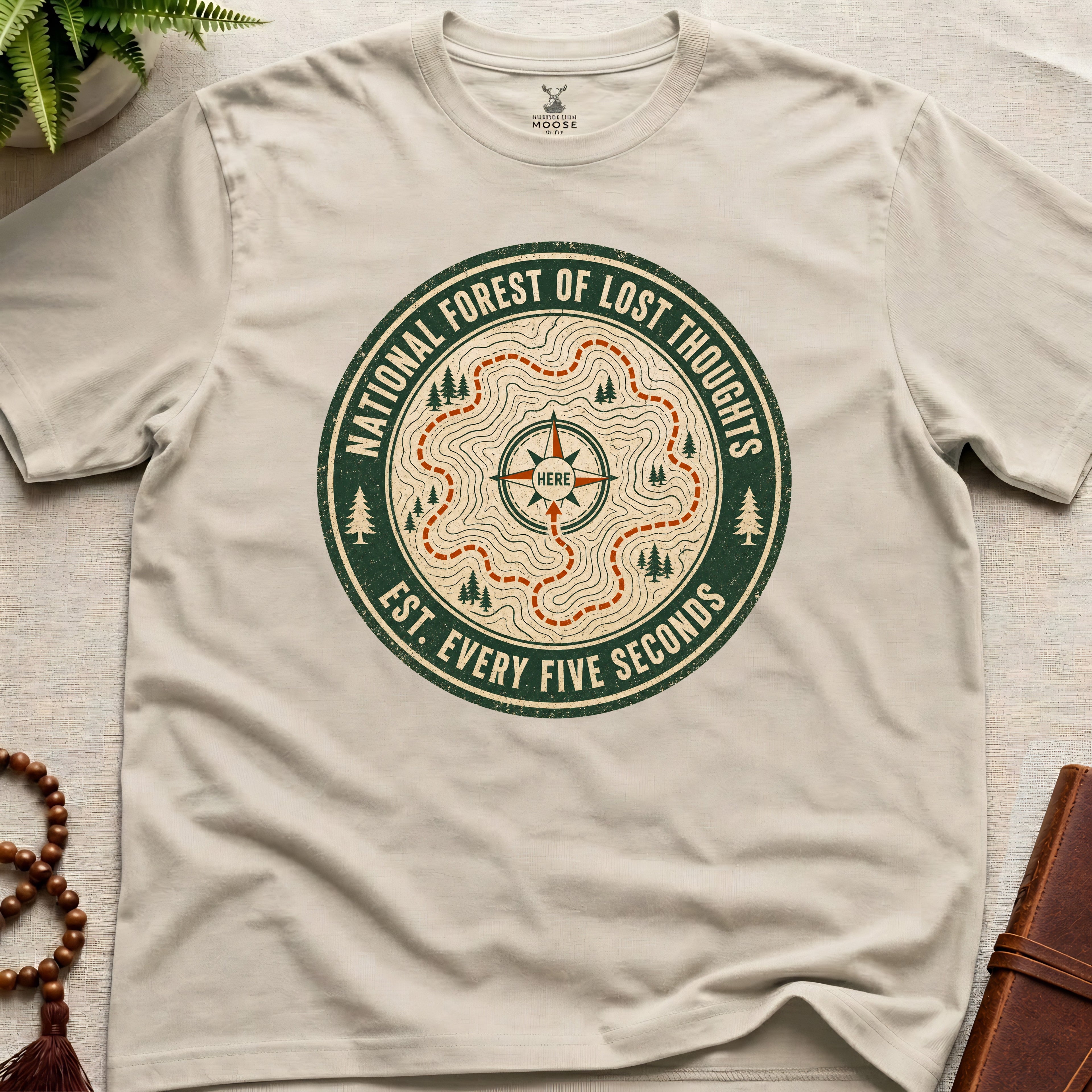 Beige mindfulness t-shirt mockup featuring National Forest of Lost Thoughts vintage trail map meditation graphic