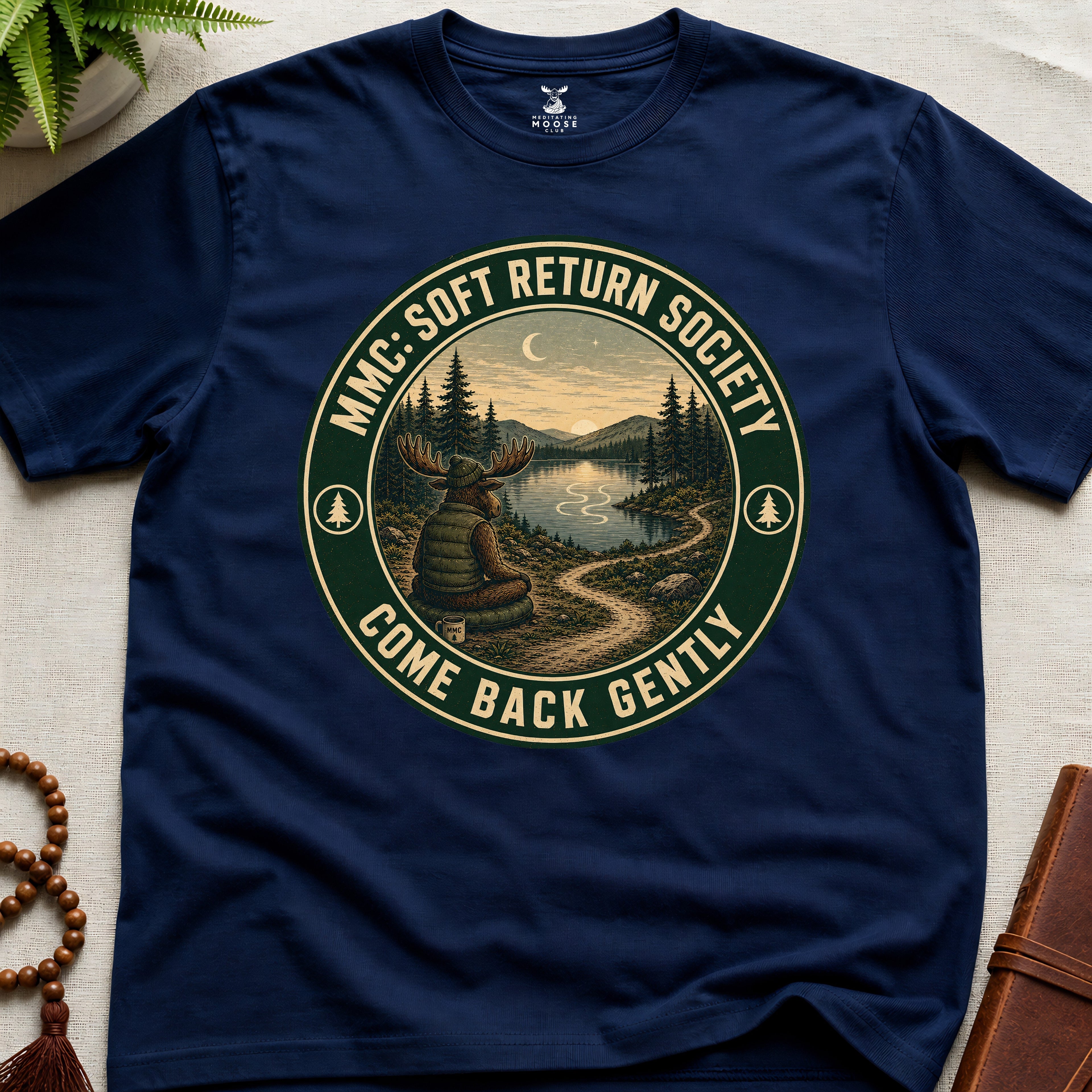 Navy mindfulness t-shirt mockup featuring Soft Return Society vintage wilderness meditation badge design