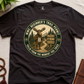 Dark brown mindfulness t-shirt mockup featuring Beginner’s Trail Permit meditating moose beginner meditation graphic