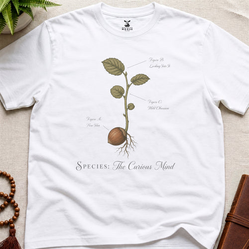 White vintage botanical graphic t-shirt featuring wandering mind natural history illustration
