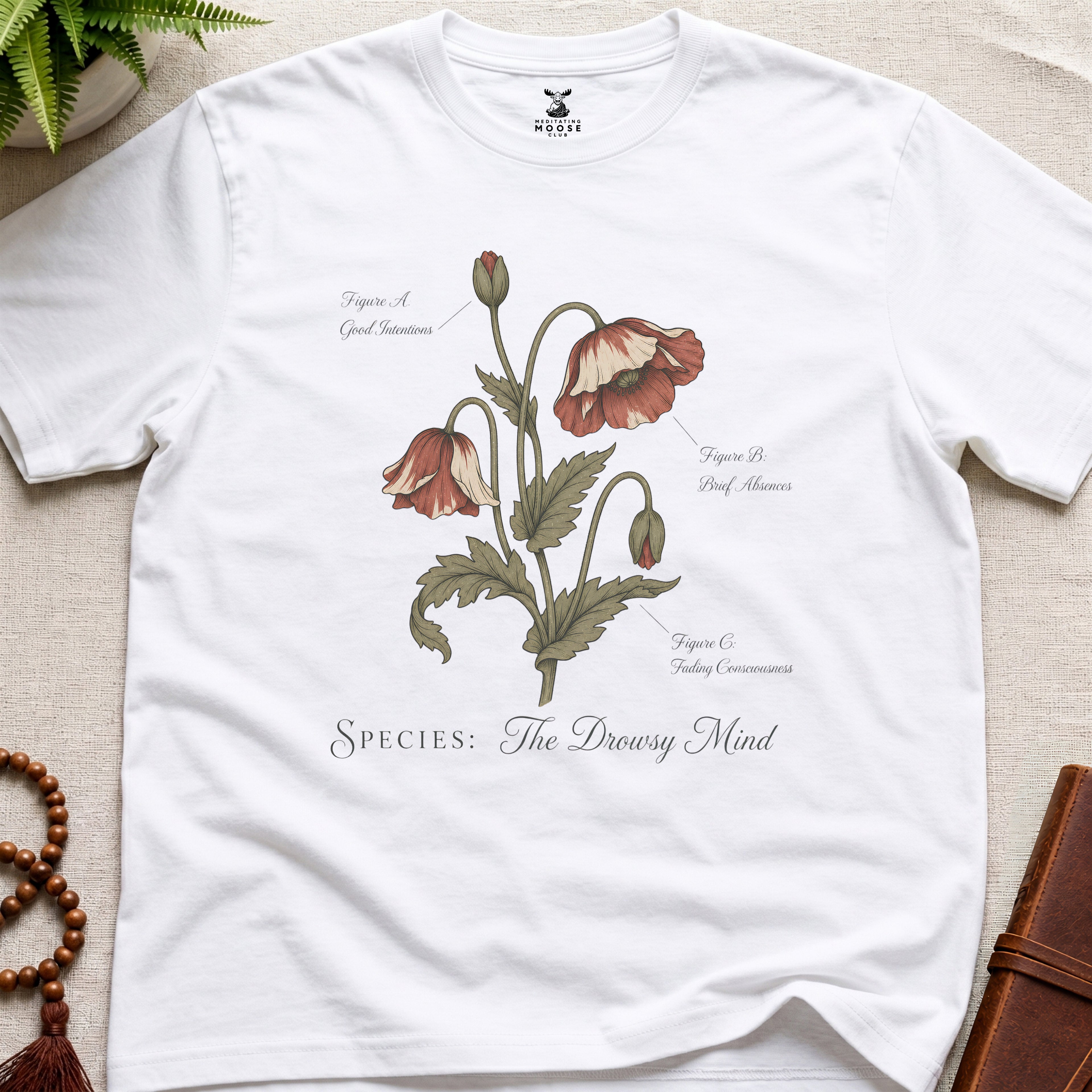 White vintage botanical graphic t-shirt featuring drowsy mind natural history illustration