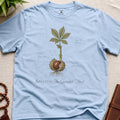 Light blue vintage botanical graphic t-shirt featuring guarded mind natural history illustration