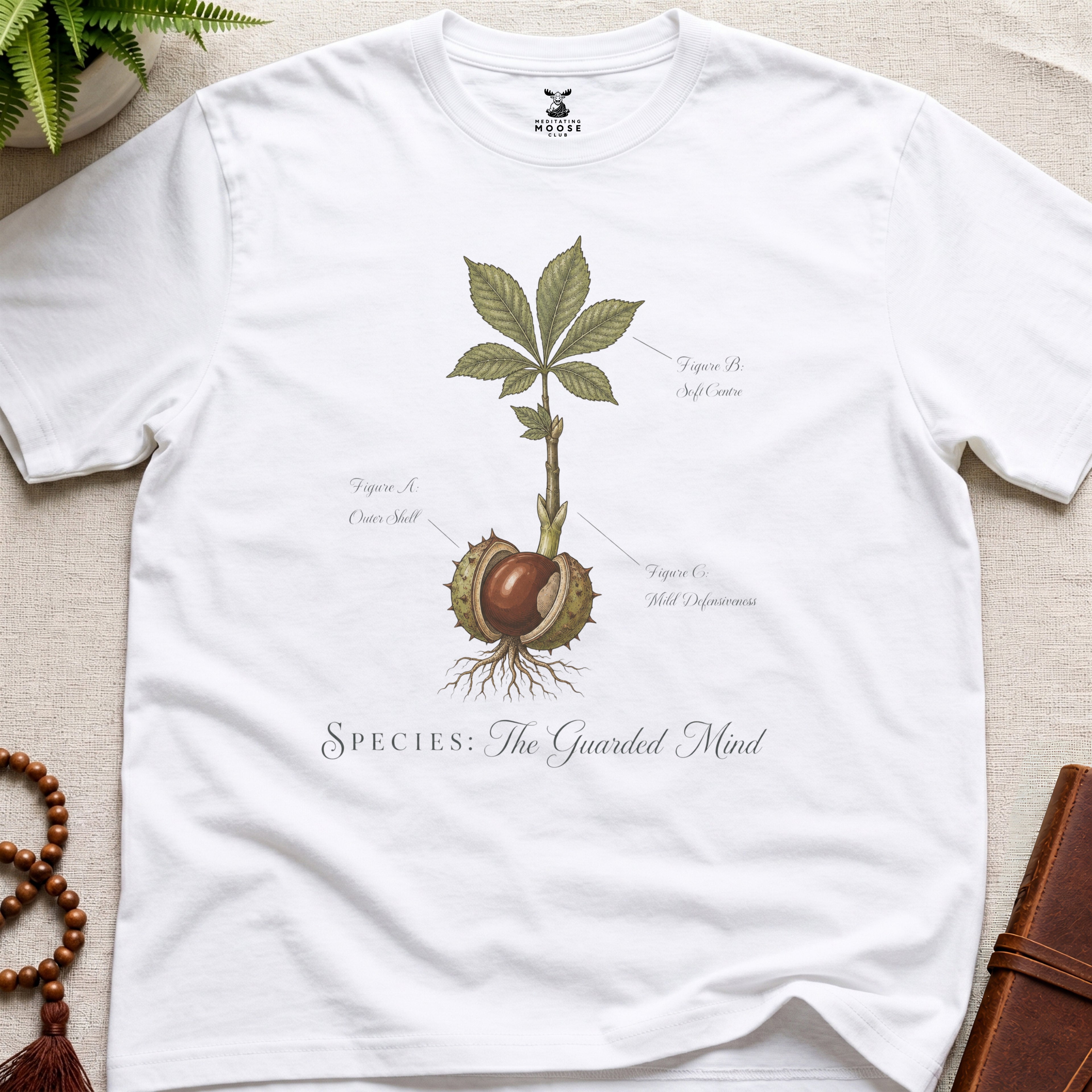 White vintage botanical graphic t-shirt featuring guarded mind natural history illustration