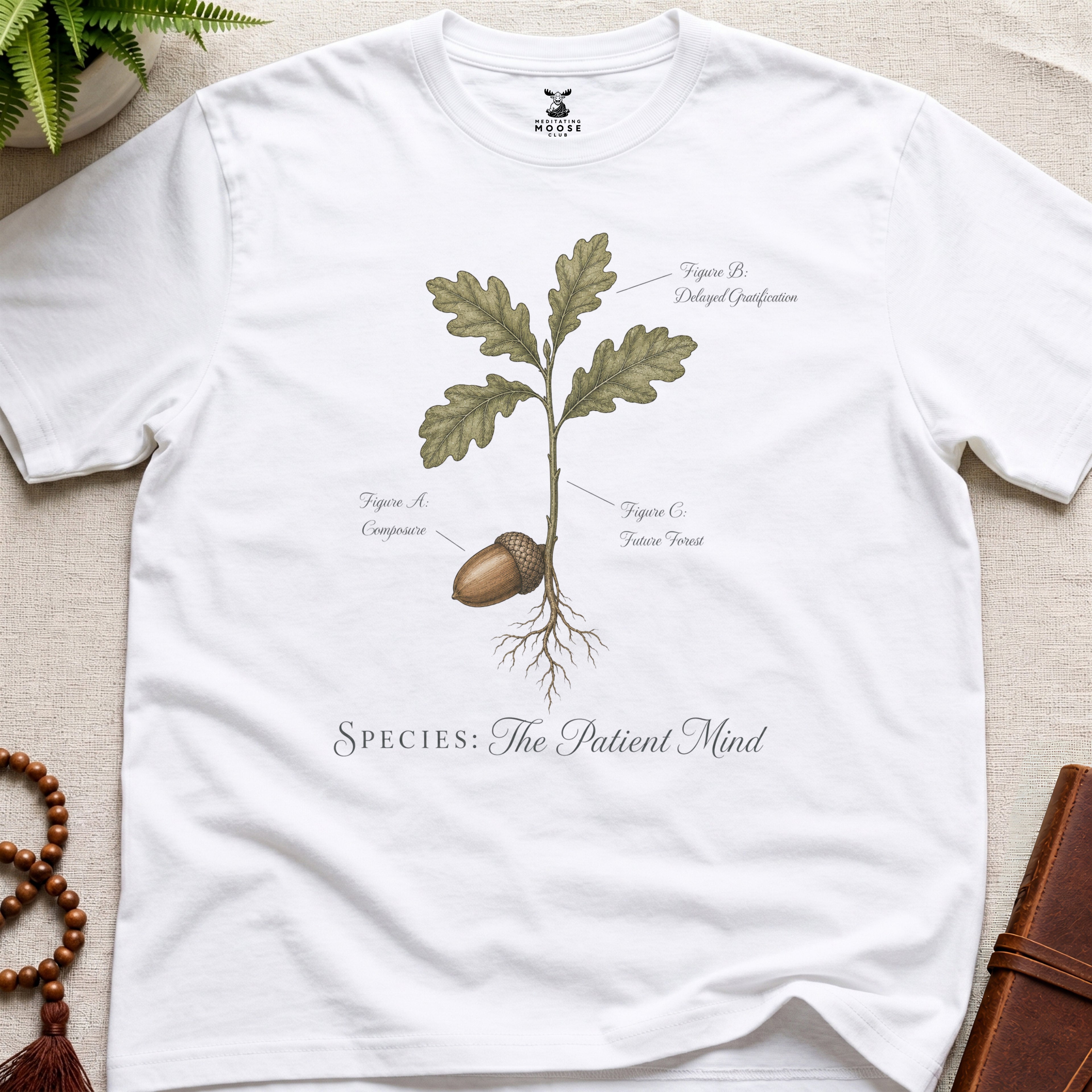 White vintage botanical graphic t-shirt featuring patient mind natural history illustration