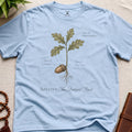 Light blue vintage botanical graphic t-shirt featuring patient mind natural history illustration