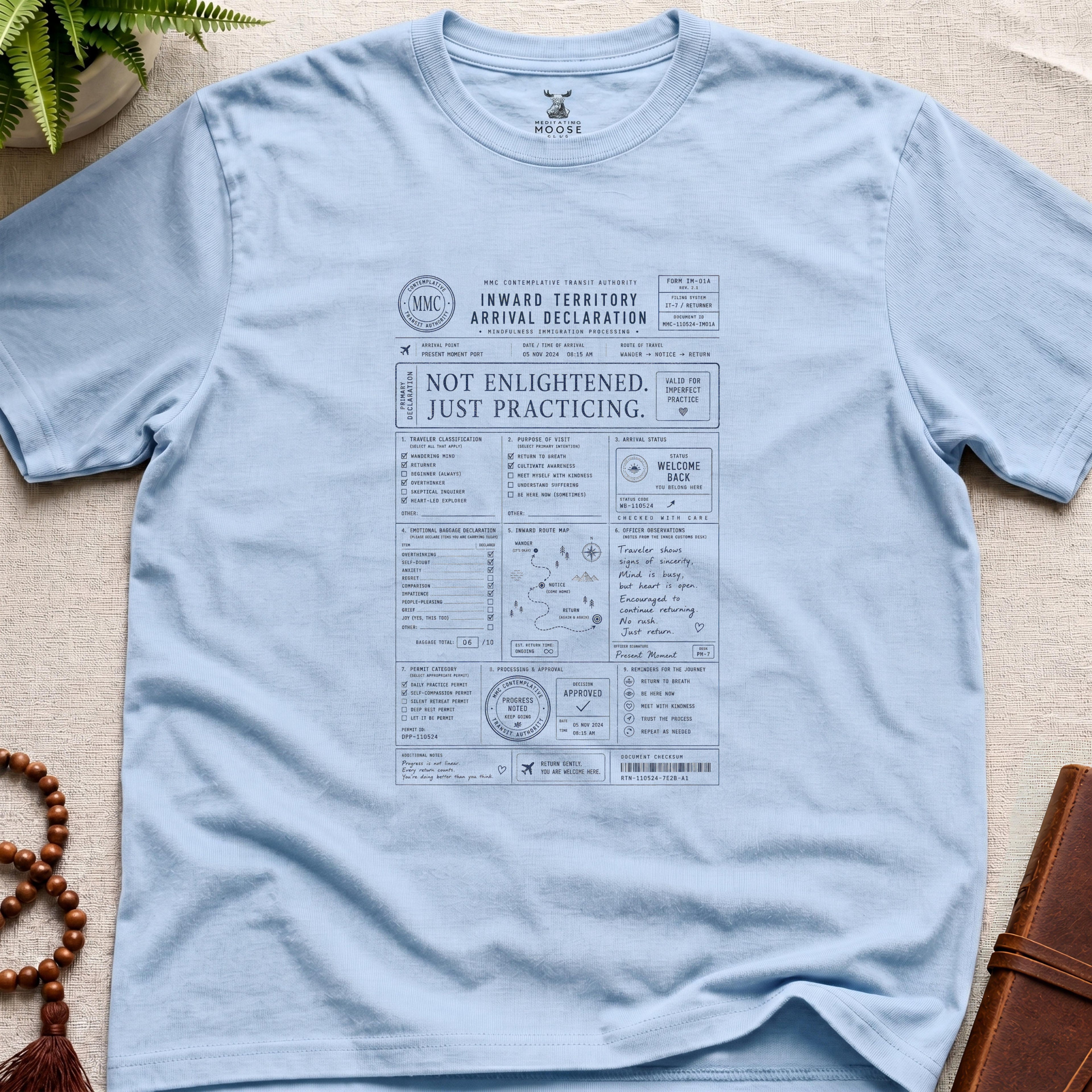 Light blue mindfulness immigration-form t-shirt design reading “Not Enlightened. Just Practicing.” with contemplative customs paperwork and inward travel graphics.