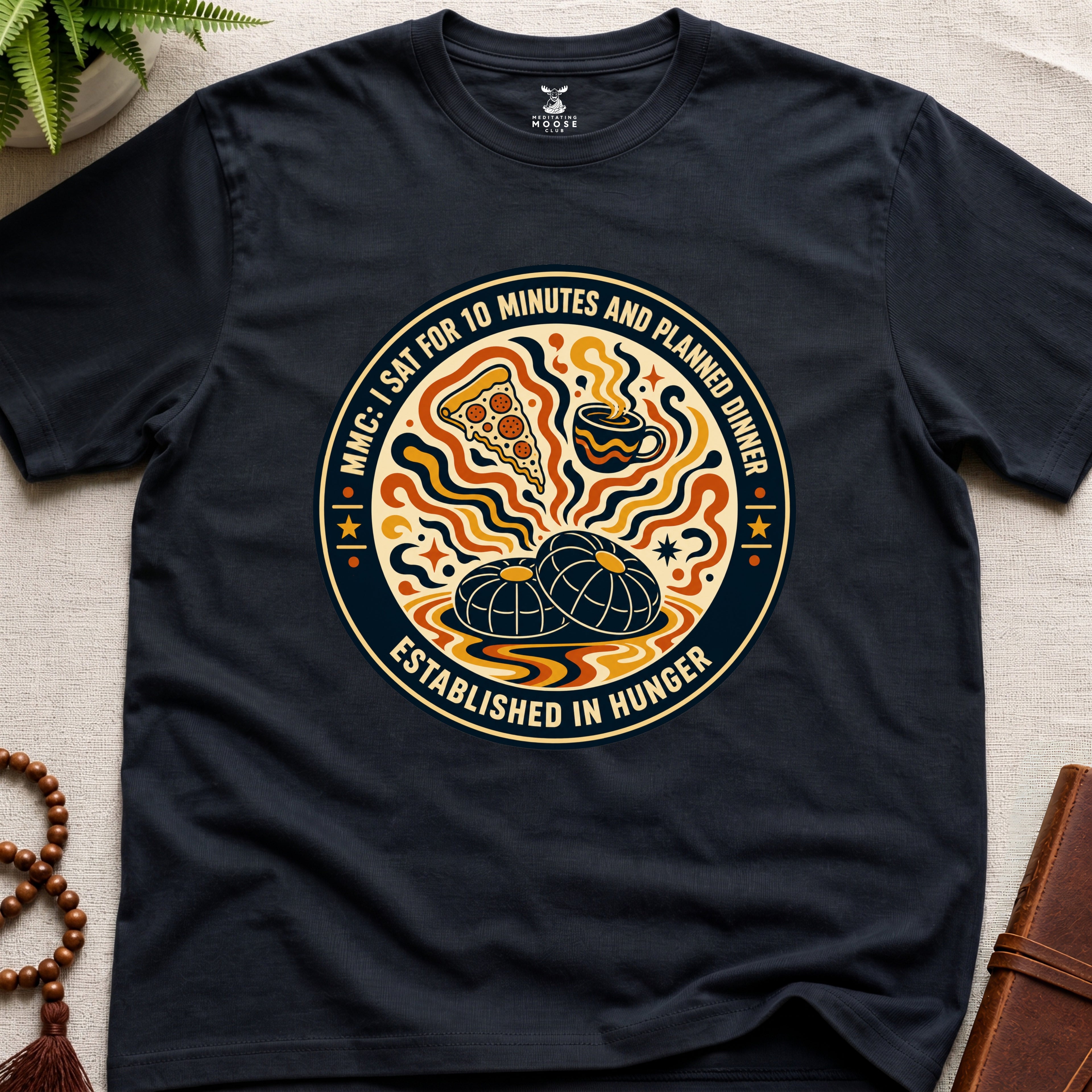 A funny black meditation t-shirt with retro hunger badge design featuring pizza coffee and mindfulness humour