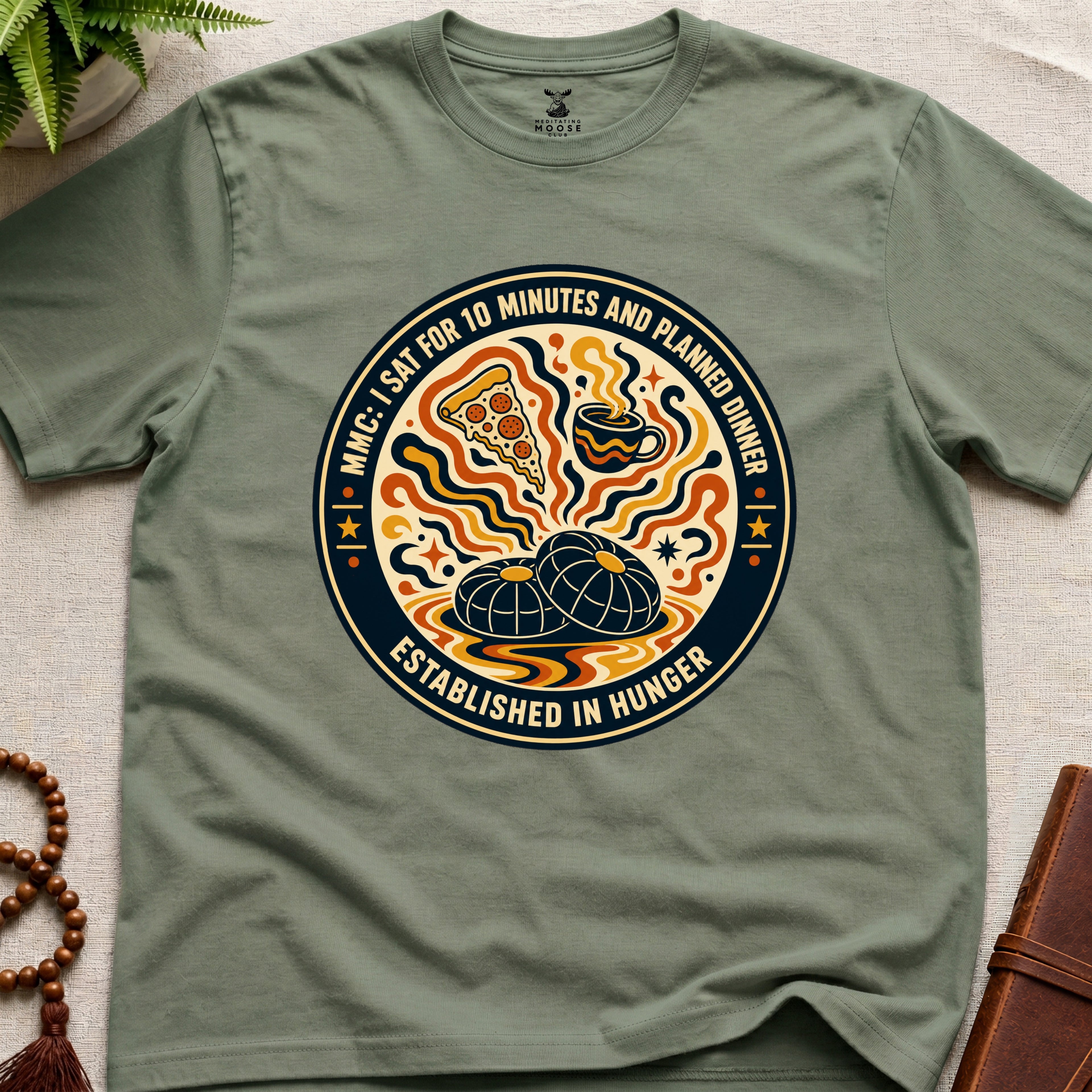 A funny military green meditation t-shirt with retro hunger badge design featuring pizza coffee and mindfulness humour