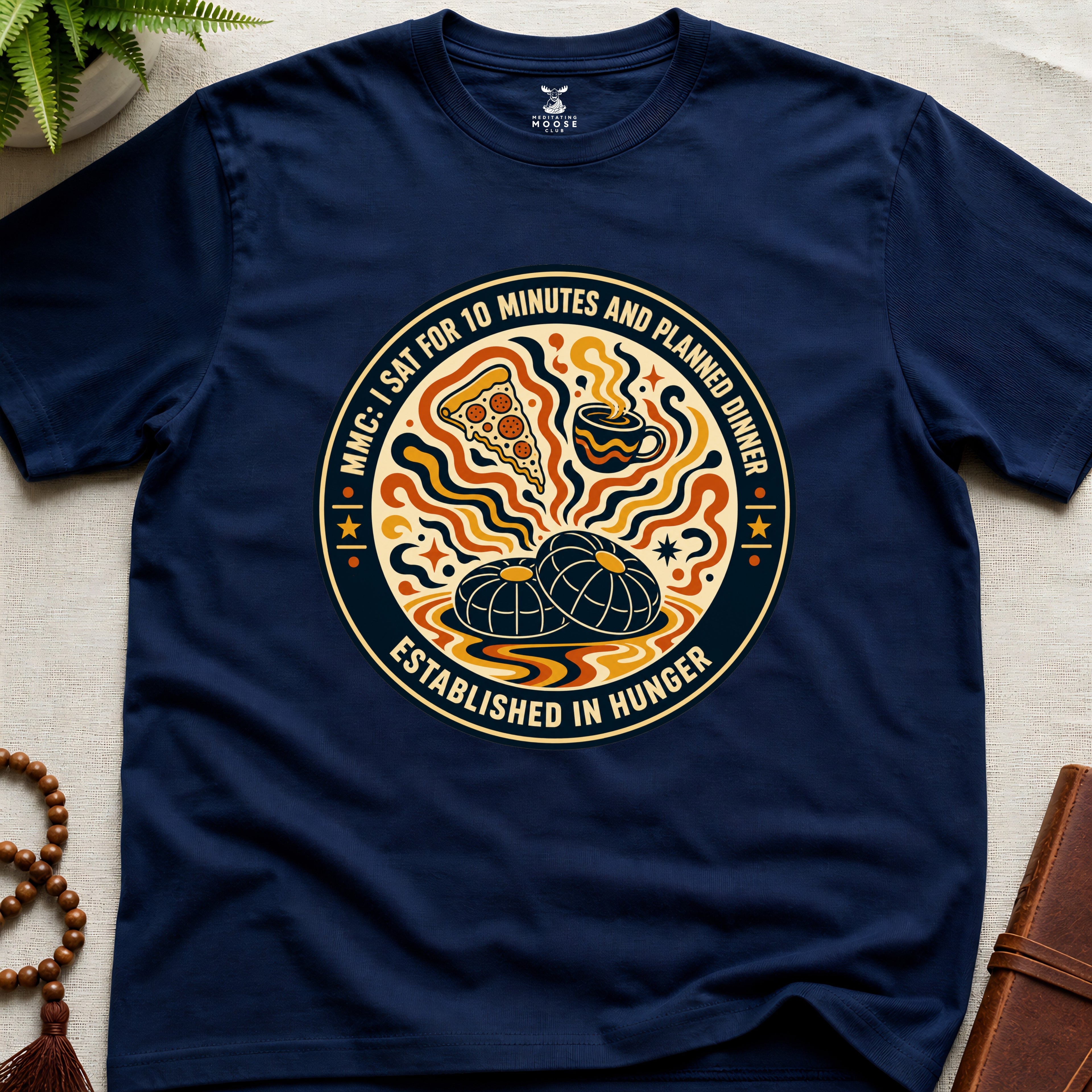 A funny navy blue meditation t-shirt with retro hunger badge design featuring pizza coffee and mindfulness humour